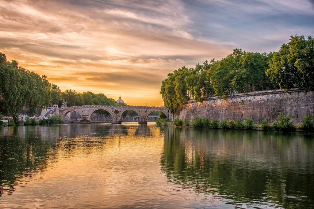 Beautiful view of Sunset in Rome with Tiber river in the foreground
