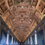 A frescoed gallery corridor inside the Vatican Museums