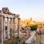 The image shows the ruins of the Roman Forum with ancient columns and structures.