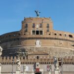 The image shows the exterior of Castel Sant'Angelo, a historic fortress in Rome.