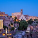 The Roman Forum and the Colosseum in Rome at dusk